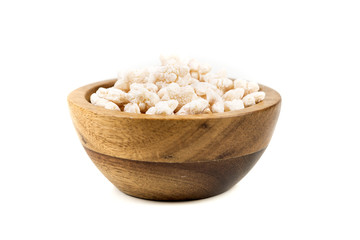 Piles of pale whole grain children's puffed cereal snack