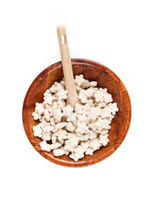 Piles of pale whole grain children's puffed cereal snack