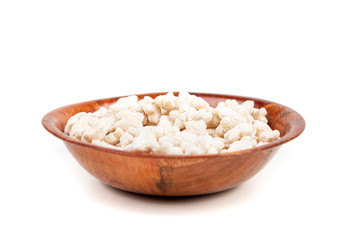 Piles of pale whole grain children's puffed cereal snack
