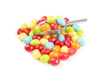 Pile of chewy multicolored shiny gummy candy beans