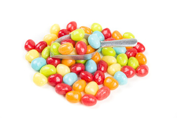 Pile of chewy multicolored shiny gummy candy beans