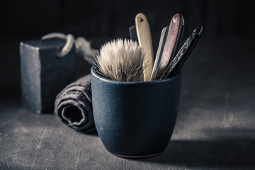 Classic tools for shave with grey soap, razor and brush