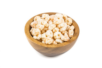 Piles of pale whole grain children's puffed cereal snack