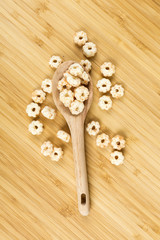 Piles of pale whole grain children's puffed cereal snack