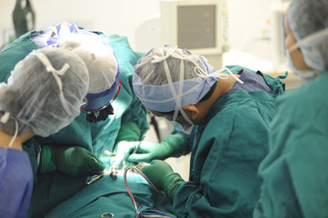 Concentrating surgeons performing operation