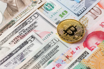 Various foreign currencies and gold coin bitcoin. Cryptocurrency or world economy business concept.
