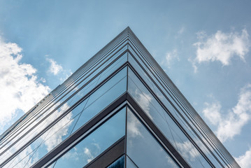 Sky and clouds reflected in modern building windows