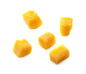 Mango slice cut to cubes close-up isolated on white background