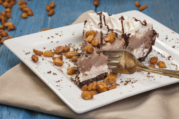 Cutting an ice cream pie with a fork.