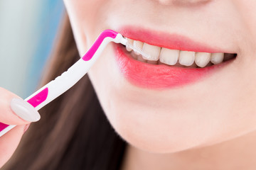 woman take interdental brush