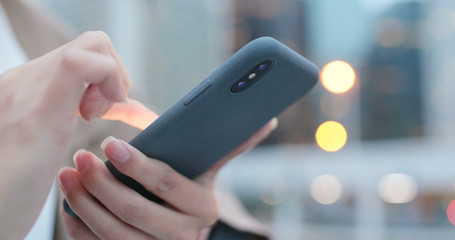 Woman use of smart phone at night