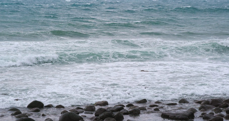 Sea wave stony beach