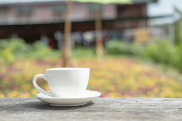white ceramic coffee cup in the nature