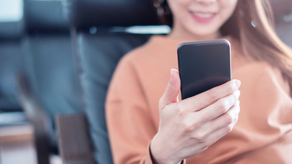 Happy female using smartphone, she chatting Online Messaging on mobile.