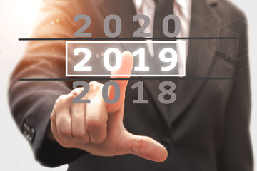 Businessman pointing business calendar happy new year 2019.