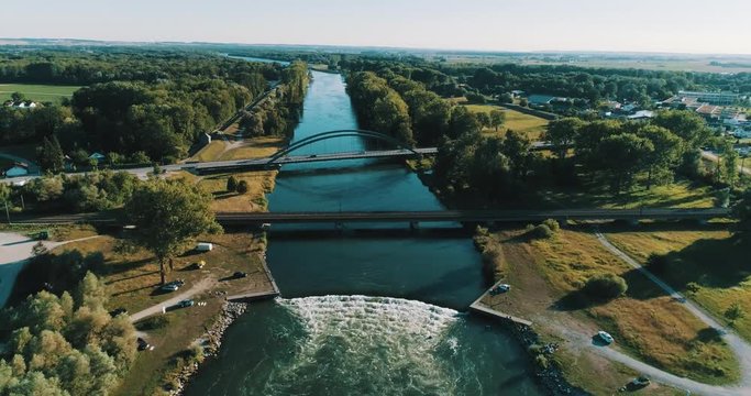 Huge River Wave for Surfers and Kayakers with small town in background