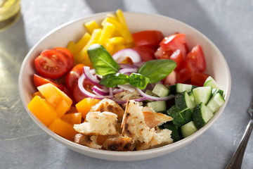 Ingredients for cooking mediterranean bread salad panzanella in ceramic bowl.