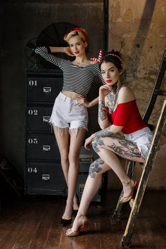 Beautiful girls dressed at pin-up style
