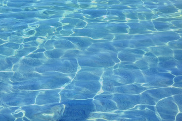 surface of blue swimming pool. Background water in sea.