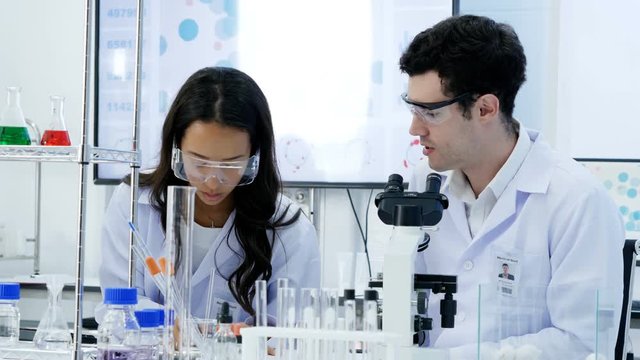 Scientist working together at lab. People with science concept. 4K Resolution.