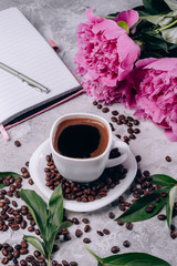 Flowers peonies pink and coffee cup