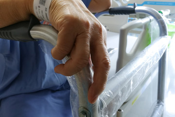 Patient hand on a walker.