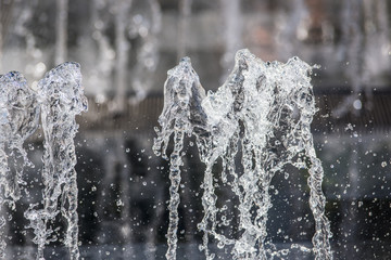 Obraz na płótnie Canvas Close-up of small splashing dancing fountains