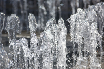 Close-up of small splashing dancing fountains