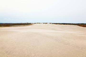 Rolling sand dune