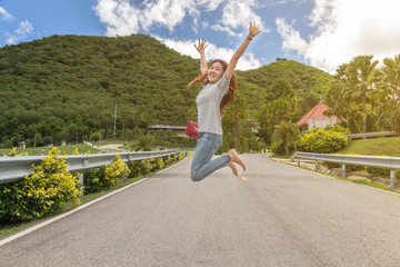 Free Happy Woman jumping Enjoying Nature Beautiful blue sky Outdoor,Freedom concept