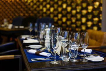 Glasses and plates on the serving table