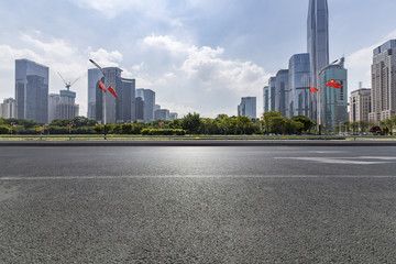 Fototapeta na wymiar Panoramic skyline and modern business office buildings with empty road,empty concrete square floor