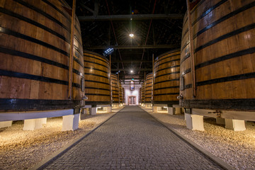 Port wine barrels in cellar, Vila Nova de Gaia, Porto, Portugal © javarman