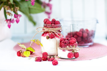 breakfasts, desserts. Yogurt with raspberry syrup and raspberry berries