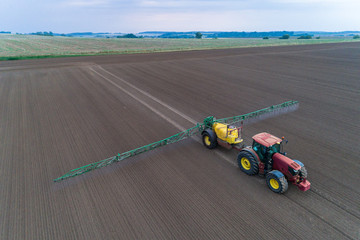 Tractor spraying the pesticides on the field