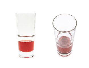 Glass of red juice isolated
