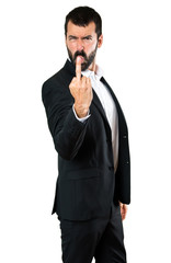 Fototapeta premium Handsome businessman making horn gesture