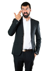 Fototapeta premium Handsome businessman making suicide gesture