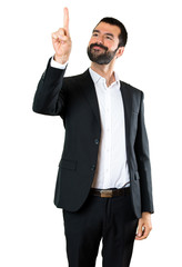Handsome businessman touching on transparent screen