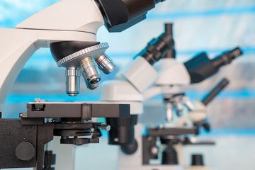 Four microscopes of different designs in the laboratory