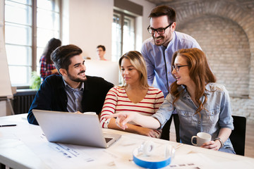 Picture of young architects discussing in office