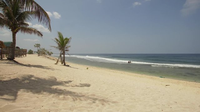 Tropical island with white sandy beach in blue lagoon, palm tree. Patarl white sand beach with turquoise water. Seascape, ocean and beautiful beach. Philippines, Anda, Pangasinan. Travel concept.