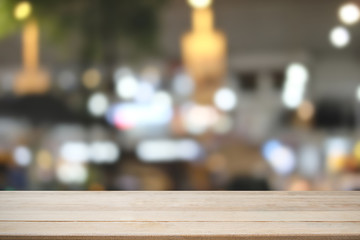 Wooden desk with bokeh city blur background, Table is empty.