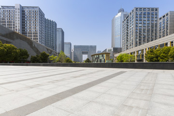 Panoramic skyline and modern business office buildings with empty road,empty concrete square floor