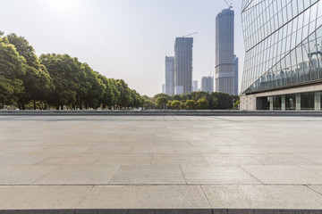 Panoramic skyline and modern business office buildings with empty road,empty concrete square floor