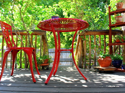 Red patio furniture abstract on deck outdoors,