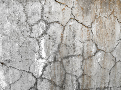 Old cracked plaster on the wall. Grunge concrete texture