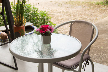 Empty table in front of blur coffee shop.