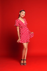 Portrait of a funny emotional young woman. Pin-up style.