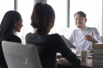 Smiling businessman during job interview.Job interview concept.Businessman explaining and listen to candidate answers.